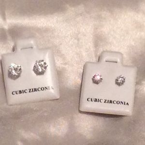 Two pairs of CZ stud earrings. Silver Tone.